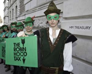 Franta introduce, din august, taxa "Robin Hood" pe tranzactiile financiare