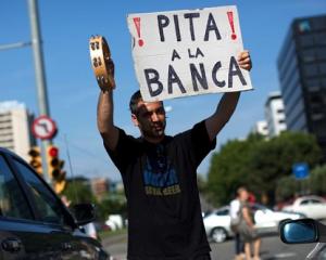 Spania va cere ajutorul zonei euro pentru patru banci