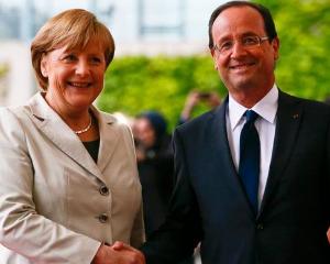 Afla de ce tine Merkel la relatia cu presedintele Frantei