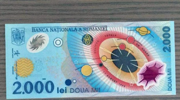 Mai ai pe acasa bancnota de 2.000 de lei cu Eclipsa de Soare? Poti primi trei salarii pe ea, daca o vinzi pe internet