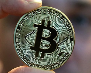 Record pentru Bitcoin: a trecut de 5.000 de dolari. Valoarea ei a depasit de patru ori uncia de aur