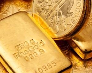 Pretul aurului scade si ar putea ajunge sub 1000 de dolari uncia
