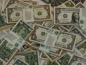 Dolarul este o moneda globala, un simbol al prosperitatii si o proba de foc pentru falsificatori